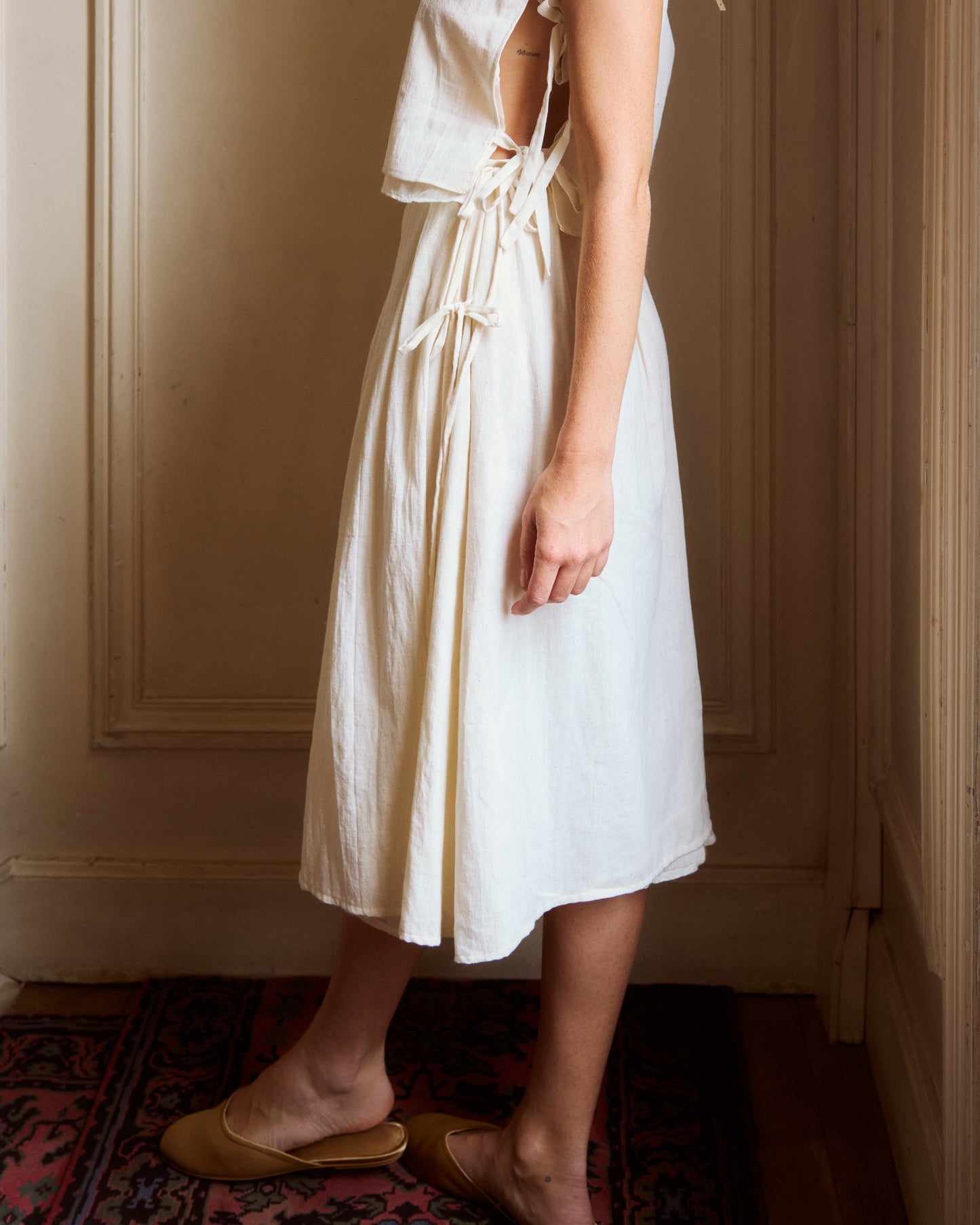 Side view of white cotton summer skirt.