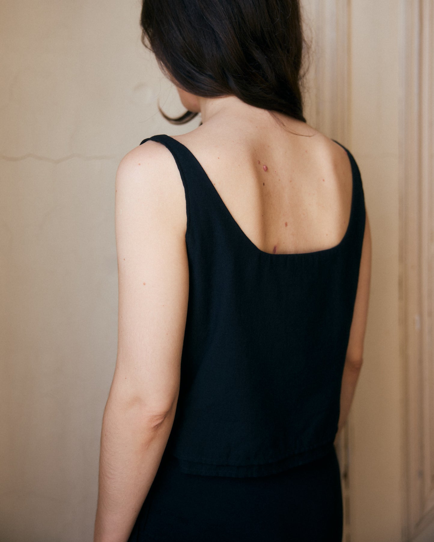 Black cotton summer top - back view showing low square neckline.