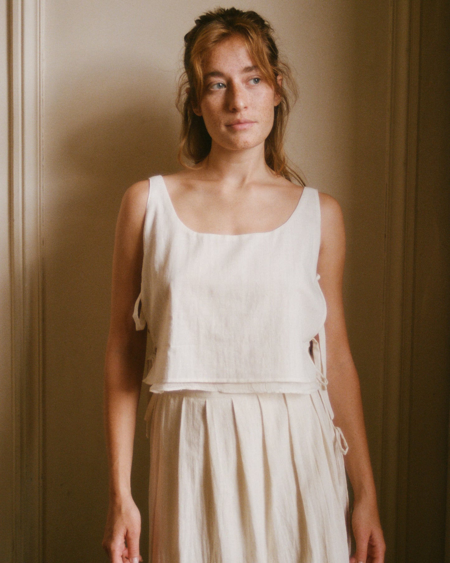 Adjustable top with side ties made from white handwoven cotton - front view