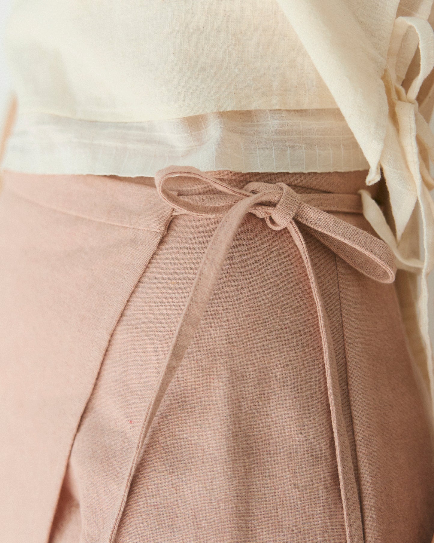 Detail of adjustable side ties for our mini-skirt.