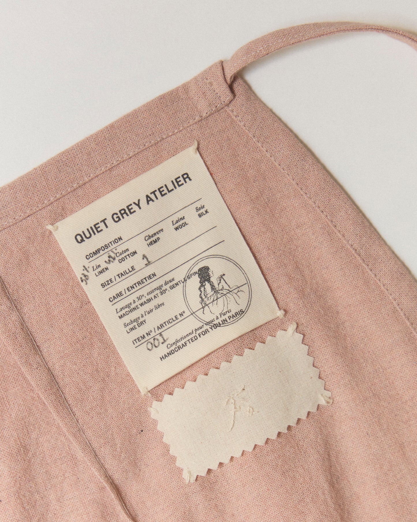 Label and example of free hand-embroidery on the inside of our mini-skirt.
