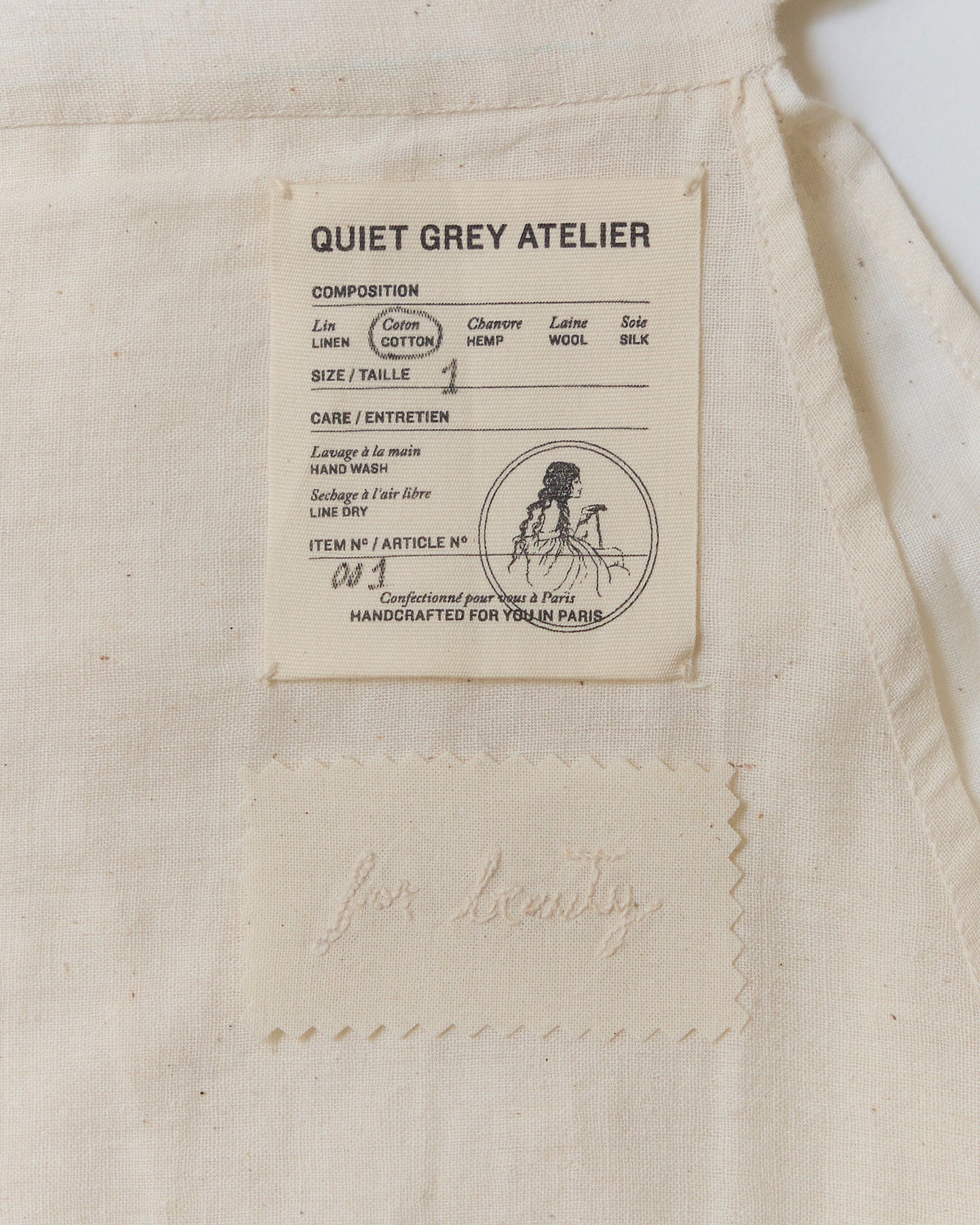 Detail of label and hand-embroidered message on the inside of the skirt.