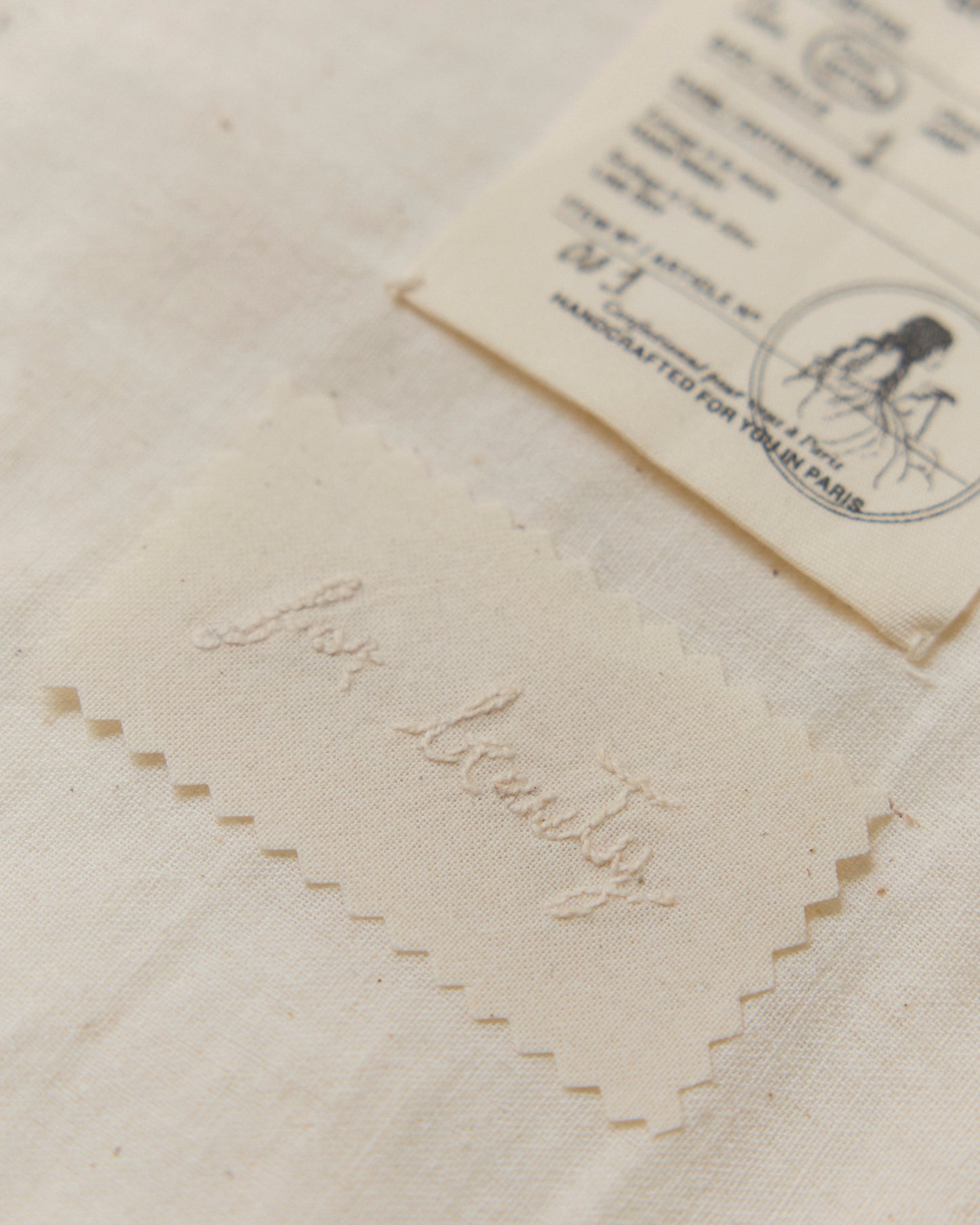 Hand-embroidered message on the inside of the skirt that reads "for beauty".