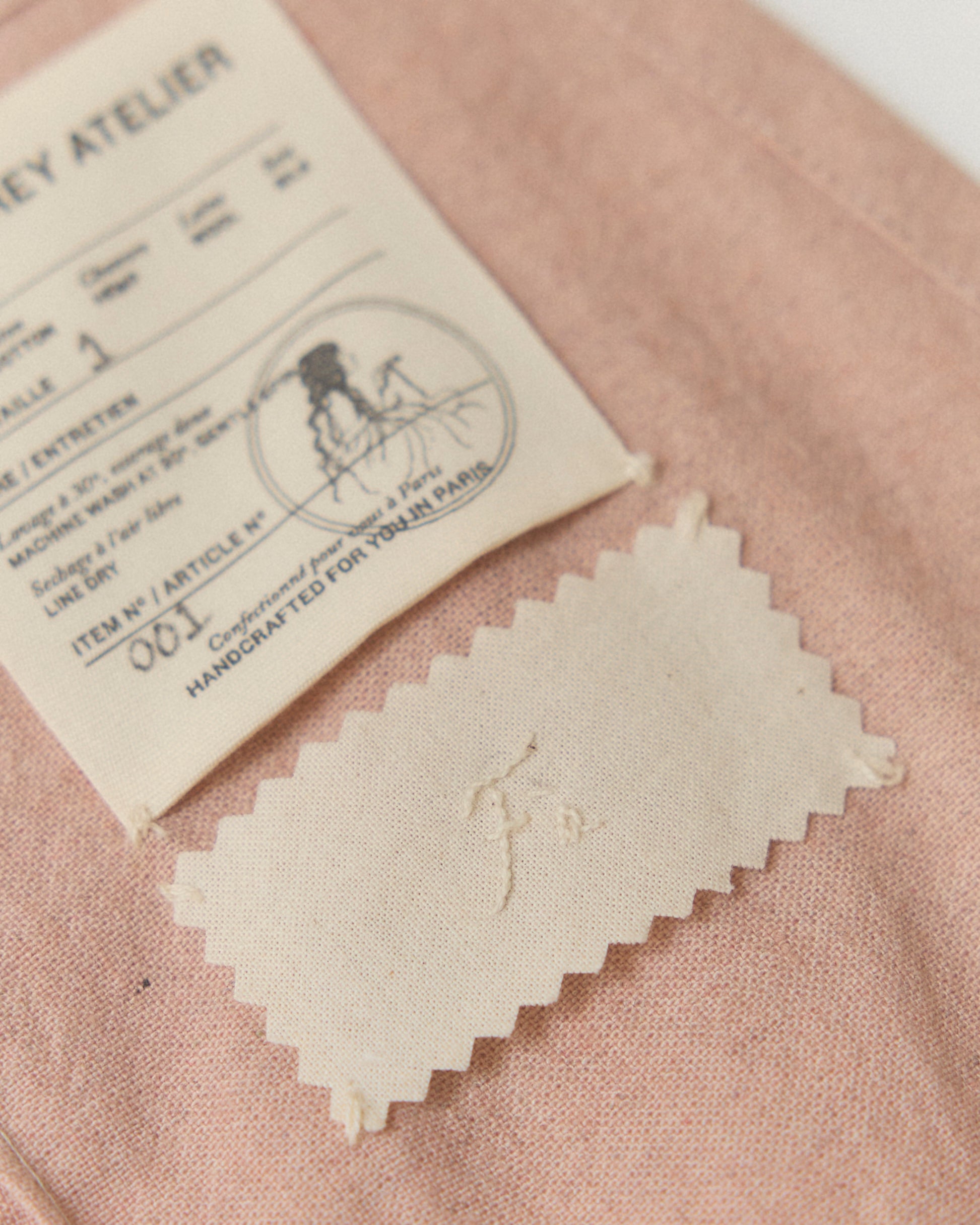 Detail of hand-embroidered name on the inside of our Mini Wrap Skirt.
